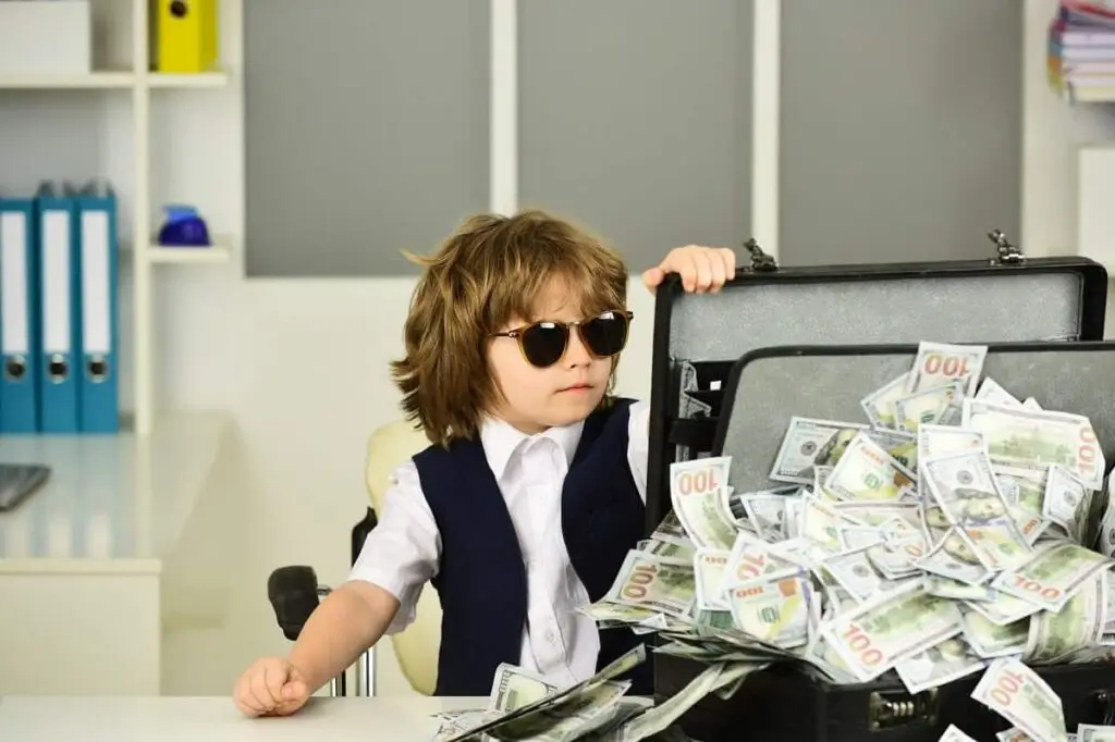 Mafia. Cute boy in sunglasses with a suitcase of money. Gambling. Gambling win. Children and cash. Financial education. Successful businessman fighting bank Tax levy